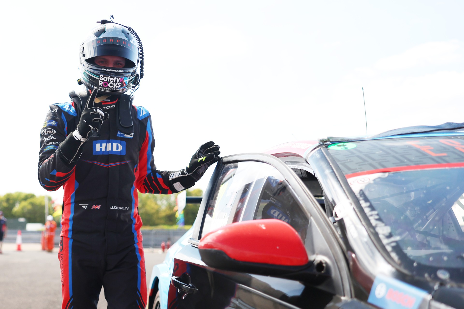 BTCC driver James Dorlin wearing his crash helmet displaying the Safety Rocks logo